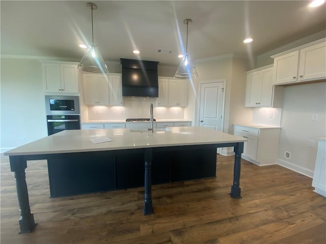 226 Montview Dr, Jefferson, GA 30549 - kitchen with custom range hood, dark wood-style floors, a large island with sink, white cabinetry, and recessed lighting