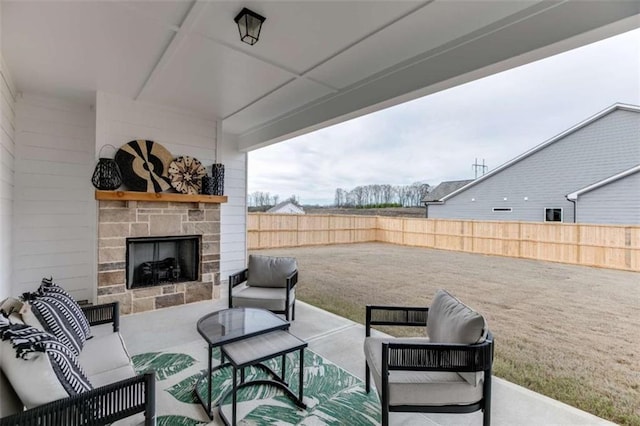 view of patio featuring an outdoor living space with a fireplace