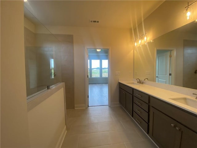 226 Montview Dr, Jefferson, GA 30549 - full bath featuring tile patterned flooring, double vanity, walk in shower, and baseboards