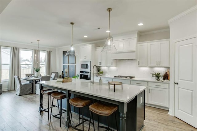 226 Montview Dr, Jefferson, GA 30549 - kitchen featuring stainless steel appliances, ornamental molding, light countertops, backsplash, and custom exhaust hood