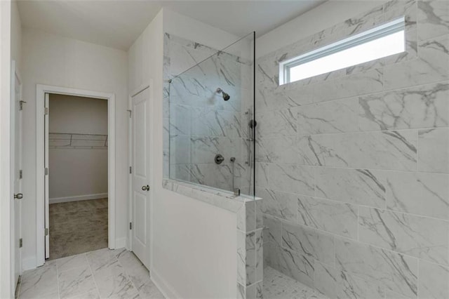226 Montview Dr, Jefferson, GA 30549 - full bath with a marble finish shower, marble look tile flooring, a spacious closet, and baseboards