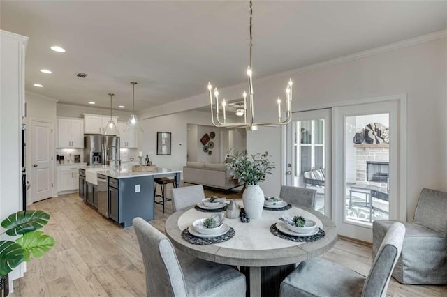 226 Montview Dr, Jefferson, GA 30549 - dining room featuring light wood-type flooring, a chandelier, crown molding, and recessed lighting