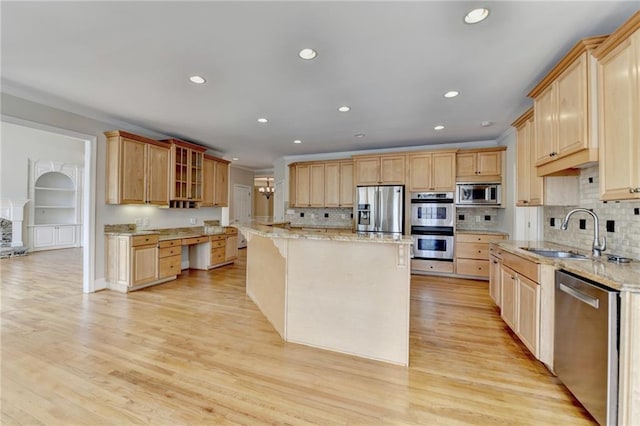 870 Longstone Lndg, Alpharetta, GA 30022 - kitchen with appliances with stainless steel finishes, light brown cabinets, a center island, recessed lighting, and crown molding