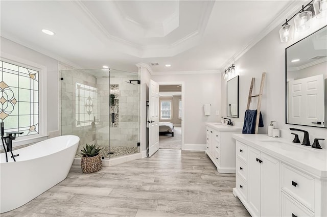 870 Longstone Lndg, Alpharetta, GA 30022 - full bath with two vanities, a stall shower, a freestanding bath, crown molding, and recessed lighting