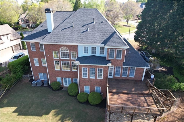 870 Longstone Lndg, Alpharetta, GA 30022 - back of house featuring a chimney, brick siding, a shingled roof, and a wooden deck