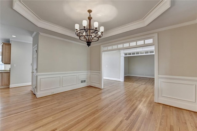 870 Longstone Lndg, Alpharetta, GA 30022 - unfurnished dining area featuring a chandelier, ornamental molding, light wood finished floors, and a wainscoted wall