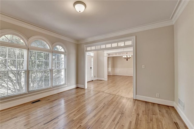 870 Longstone Lndg, Alpharetta, GA 30022 - unfurnished room with crown molding, light wood-type flooring, and a chandelier