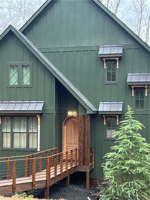 6 Huntington Pl, Dahlonega, GA 30533 - view of side of home featuring board and batten siding, roof with shingles, and a deck