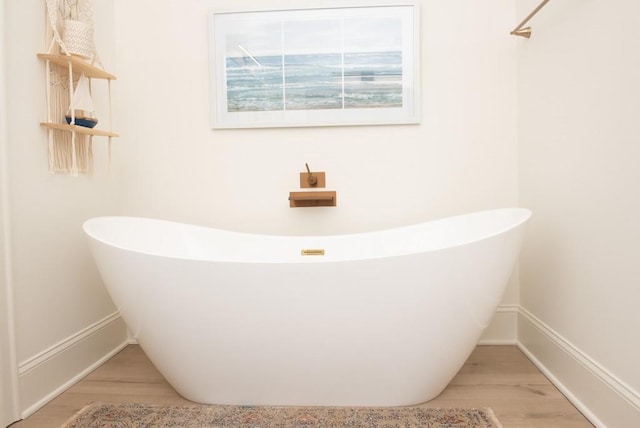 6 Huntington Pl, Dahlonega, GA 30533 - full bathroom with wood finished floors, a soaking tub, and baseboards