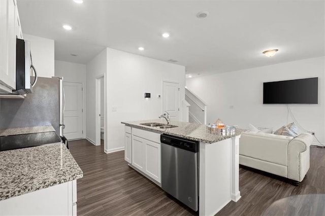 kitchen with white cabinetry, stainless steel appliances, sink, and dark hardwood / wood-style floors