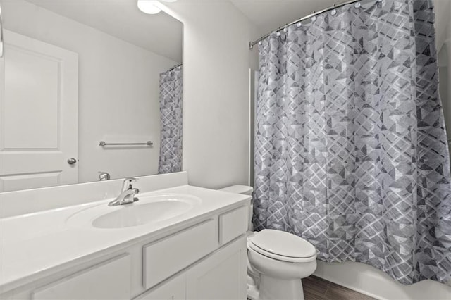 full bathroom featuring vanity, toilet, and shower / tub combo