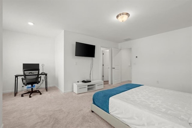 bedroom featuring light colored carpet