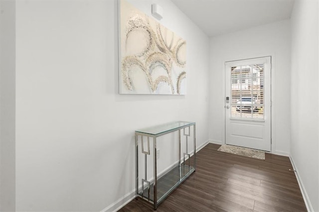 doorway with dark hardwood / wood-style floors