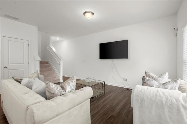 living room with dark hardwood / wood-style flooring