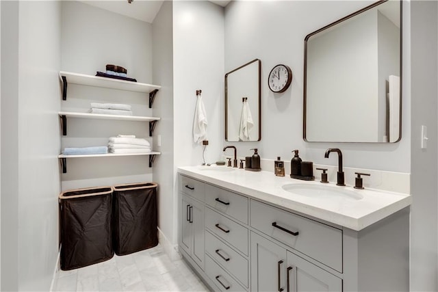 full bathroom featuring double vanity and a sink