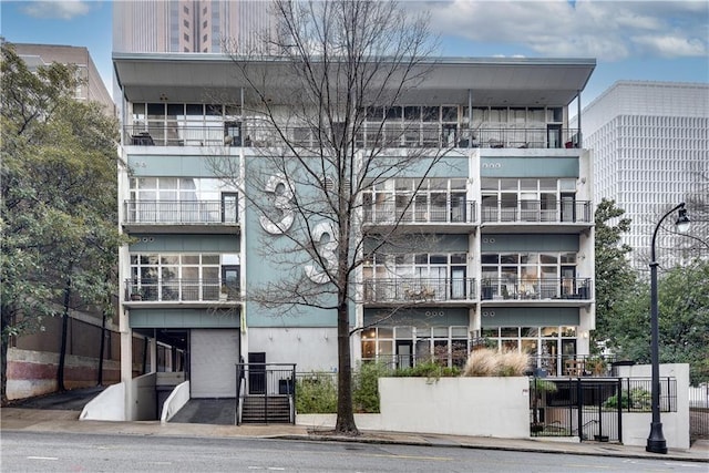 view of building exterior featuring fence