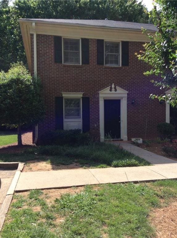 136 Sterling Ct, Alpharetta, GA 30004 - colonial-style house featuring brick siding