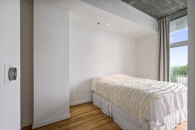 943 Peachtree St NE Unit 716, Atlanta, GA 30309 - bedroom with wood finished floors and baseboards