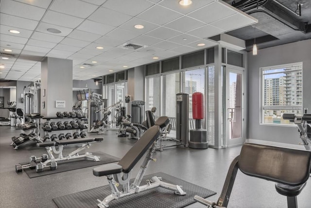 943 Peachtree St NE Unit 716, Atlanta, GA 30309 - exercise room with a drop ceiling and baseboards