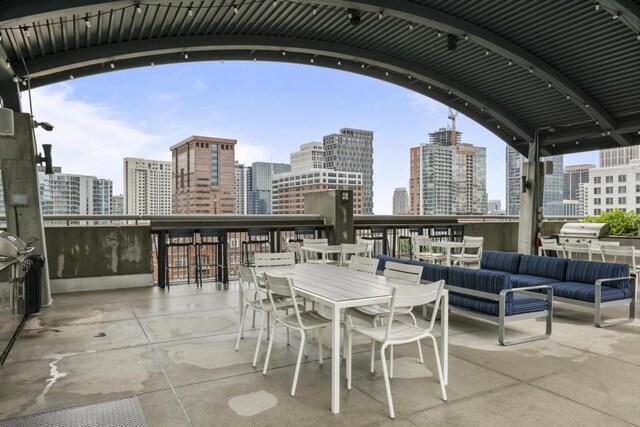 943 Peachtree St NE Unit 716, Atlanta, GA 30309 - view of patio with a view of skyline and an outdoor hangout area