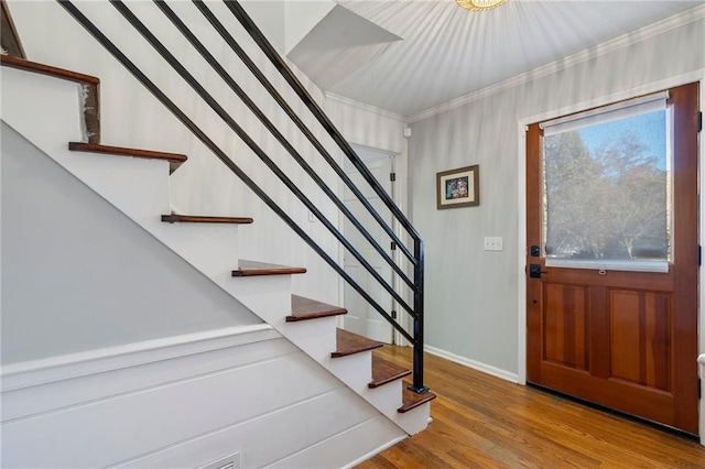 entrance foyer with crown molding and light wood-type flooring