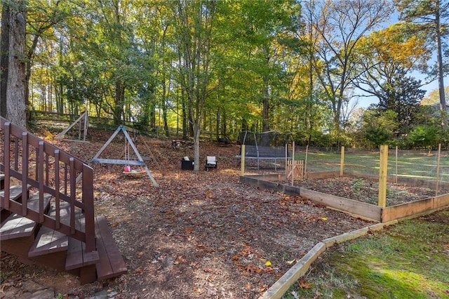 view of yard featuring a trampoline