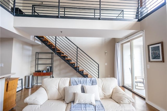 living room featuring a high ceiling