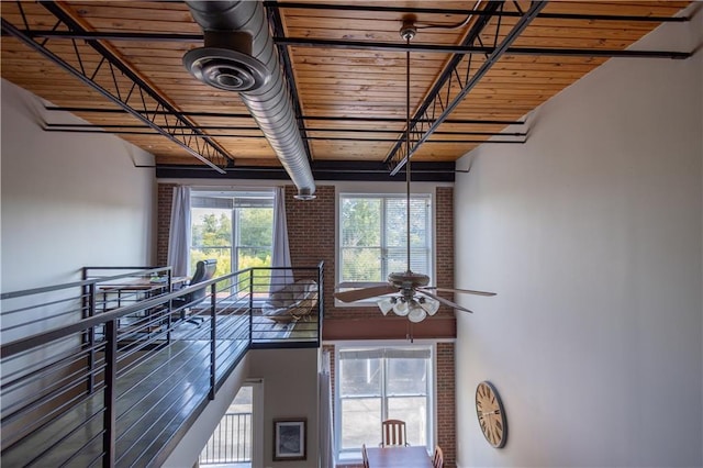 interior space featuring ceiling fan and wood ceiling