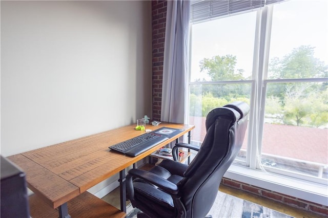 home office with hardwood / wood-style flooring