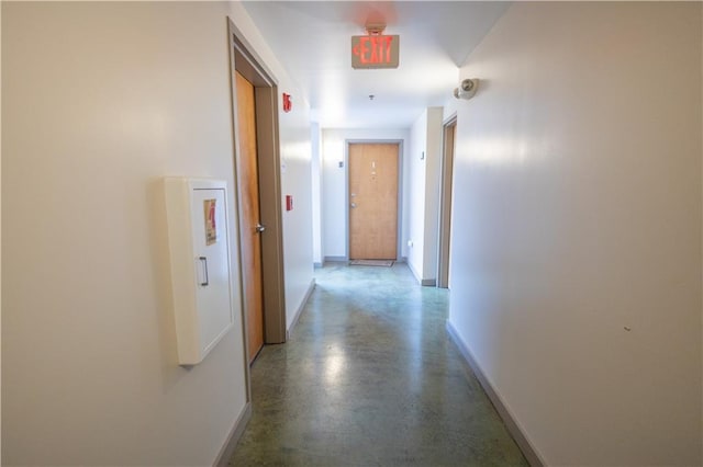 hallway featuring concrete flooring