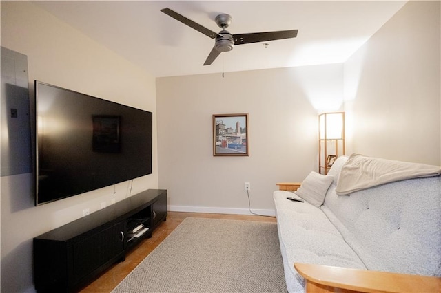 living room with ceiling fan and hardwood / wood-style flooring