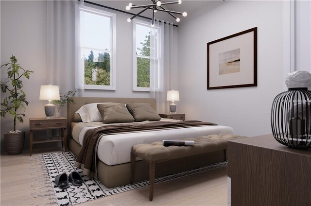 bedroom with light hardwood / wood-style floors and an inviting chandelier