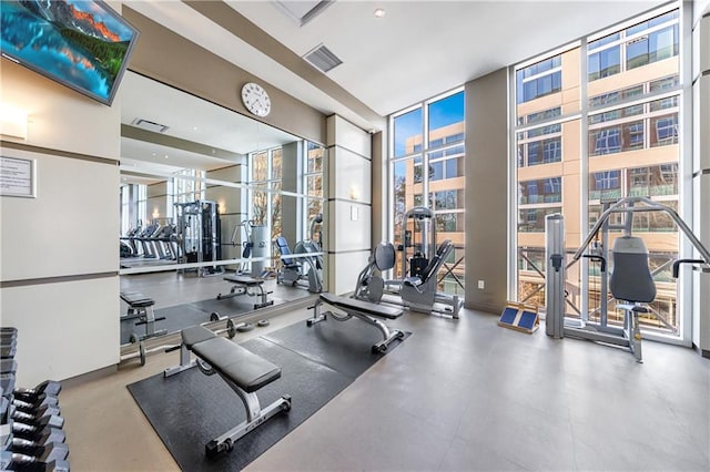 workout area with visible vents and floor to ceiling windows