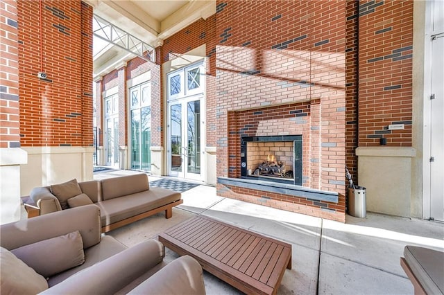 interior space with an outdoor brick fireplace