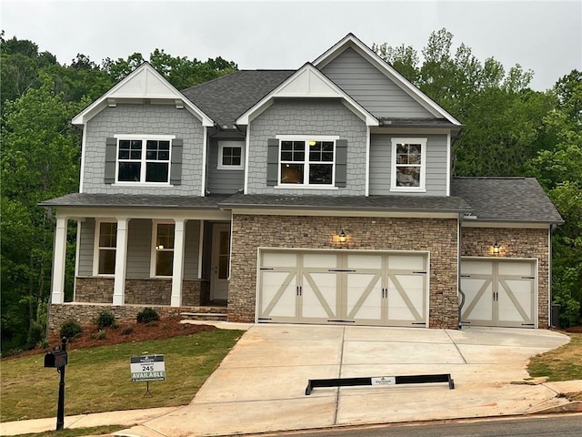 305 Riverwood Pass, Dallas, GA 30157 - craftsman-style home featuring a garage and a front lawn