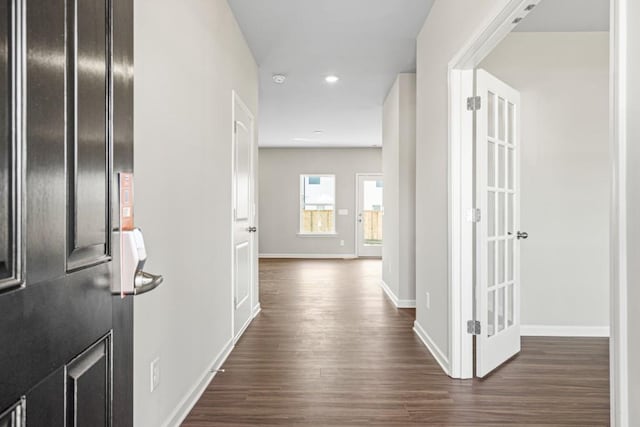 corridor featuring dark wood-type flooring