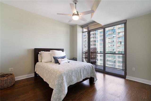 270 17th St NW Unit 2210, Atlanta, GA 30363 - bedroom featuring wood finished floors, baseboards, floor to ceiling windows, and access to outside