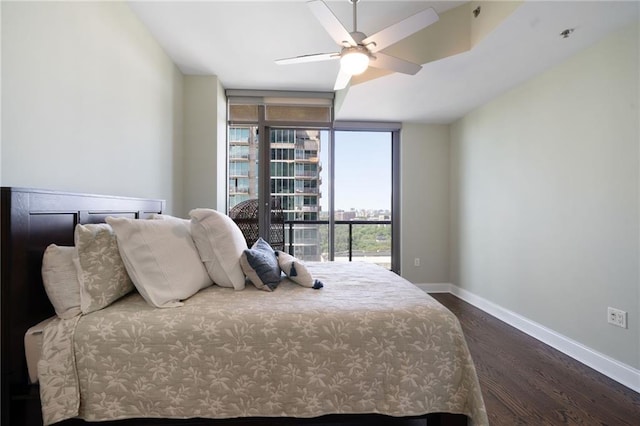 270 17th St NW Unit 2210, Atlanta, GA 30363 - bedroom featuring dark wood finished floors, baseboards, floor to ceiling windows, and a ceiling fan