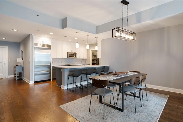 270 17th St NW Unit 2210, Atlanta, GA 30363 - dining area featuring dark wood-style flooring, recessed lighting, and baseboards