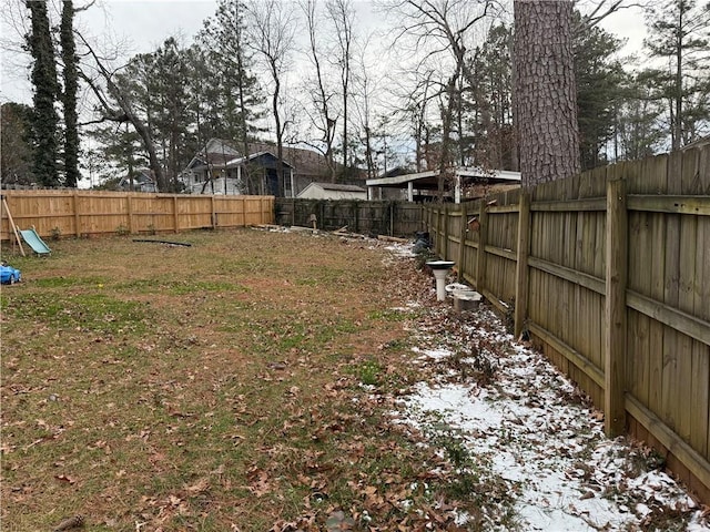 view of yard layered in snow