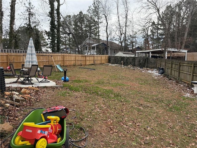 view of yard with a playground and a patio area