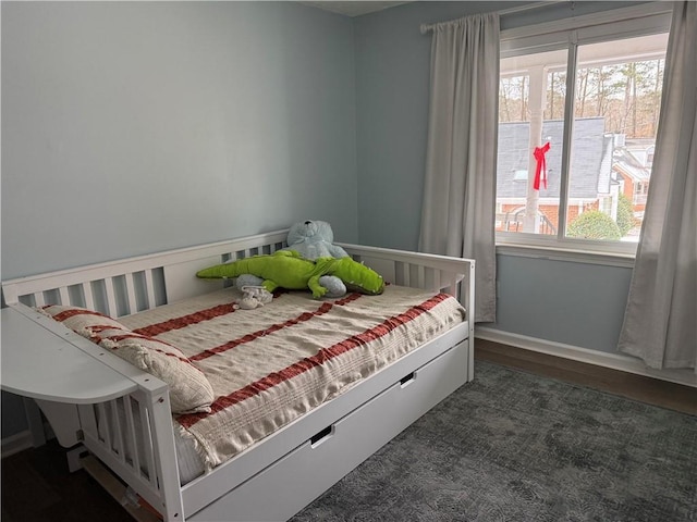 bedroom featuring multiple windows