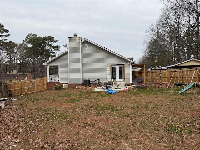 back of house featuring a patio, a yard, and cooling unit