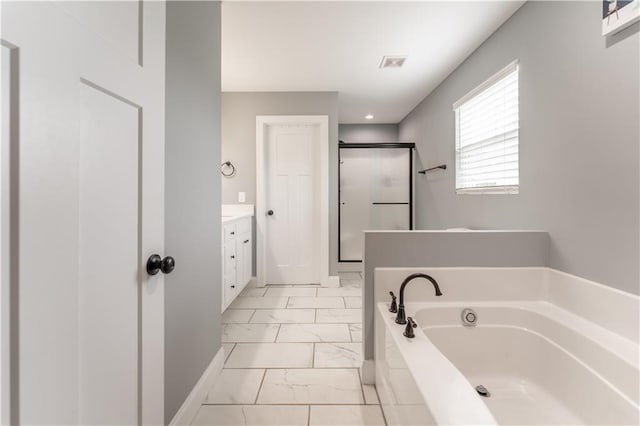 250 Silas Rd, Dahlonega, GA 30533 - bathroom featuring marble finish floors, vanity, a shower stall, and a garden tub