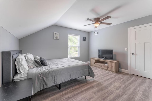 250 Silas Rd, Dahlonega, GA 30533 - bedroom with wood finished floors, lofted ceiling, a ceiling fan, and baseboards