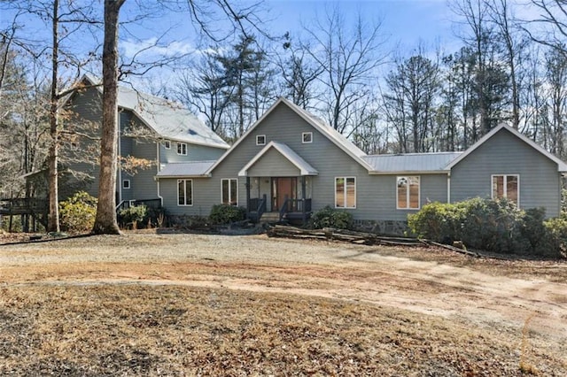 view of front facade with covered porch and metal roof