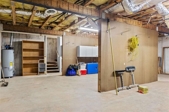 basement with visible vents and gas water heater