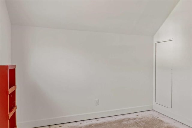 empty room featuring unfinished concrete flooring