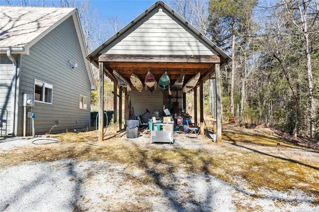 exterior space with a carport