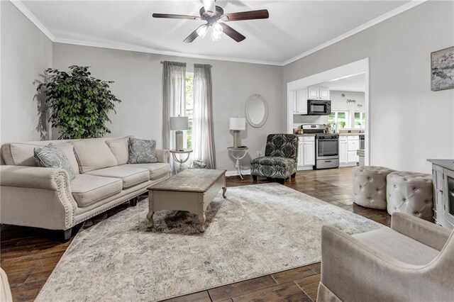 4481 Mclain Cir, Acworth, GA 30101 - living area featuring a ceiling fan, crown molding, dark wood-style floors, and a wealth of natural light